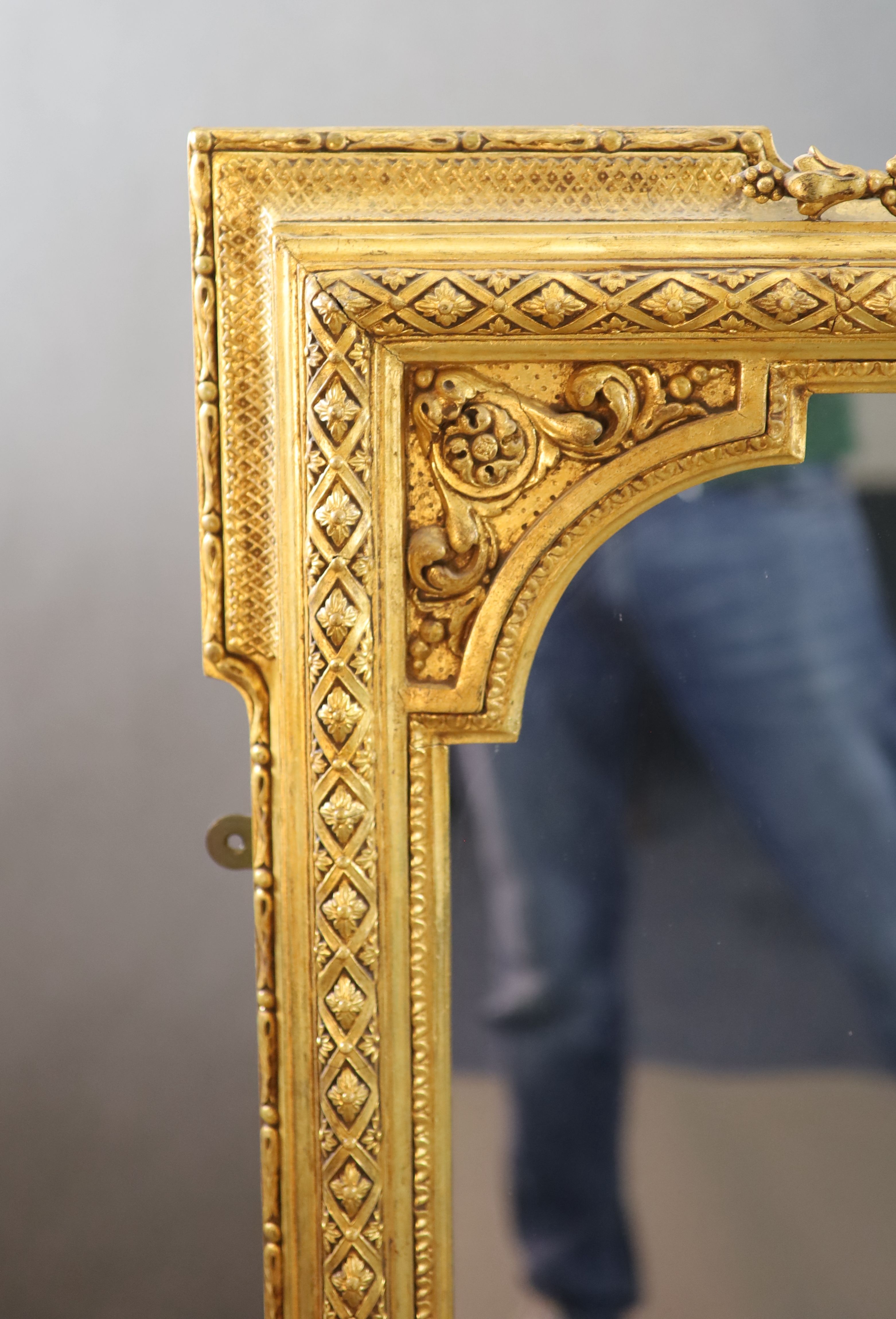 A Victorian gilt gesso overmantel W. 4ft. 6in. H.4ft. 10in.